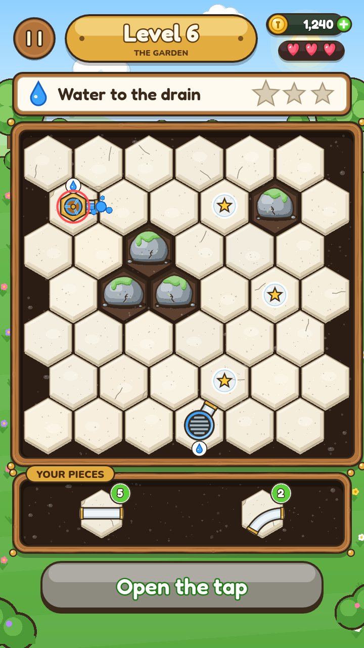 A puzzle level in the Garden: pieces waiting in the tray beside a hex board